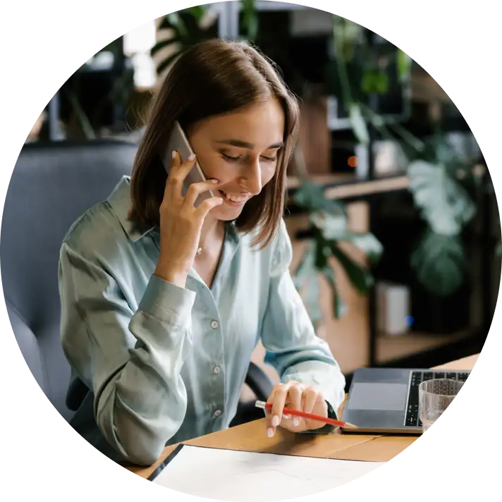 Woman smiling on the phone talking about her mortgage